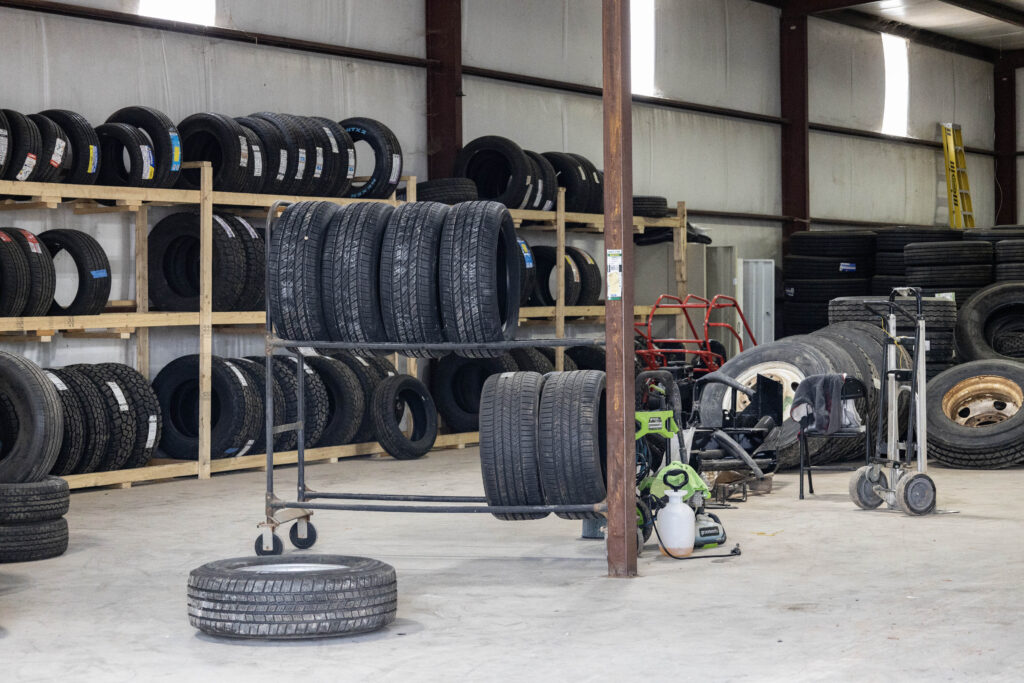 selection of new and used tires at local tire shop